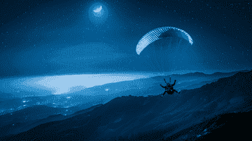 Nighttime Adventures: Parachuting Under the Moonlight
